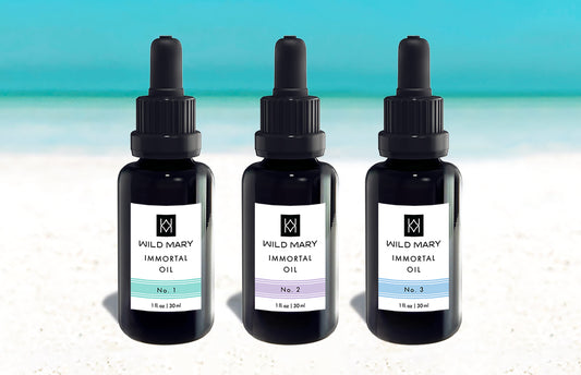Wild Mary Immortal Oil Trio featuring Rosemary Elixir No. 1 Rosemary, No. 2 Lavender, and No. 3 Rosemary Mint on Holbox Island beach