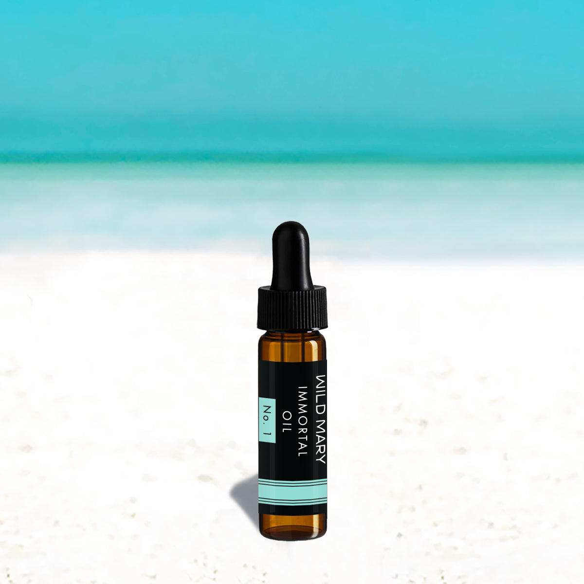 Wild Mary Mini Immortal Oil No. 1 Rosemary Restorative Face Oil in a black glass dropper bottle on Holbox Island beach