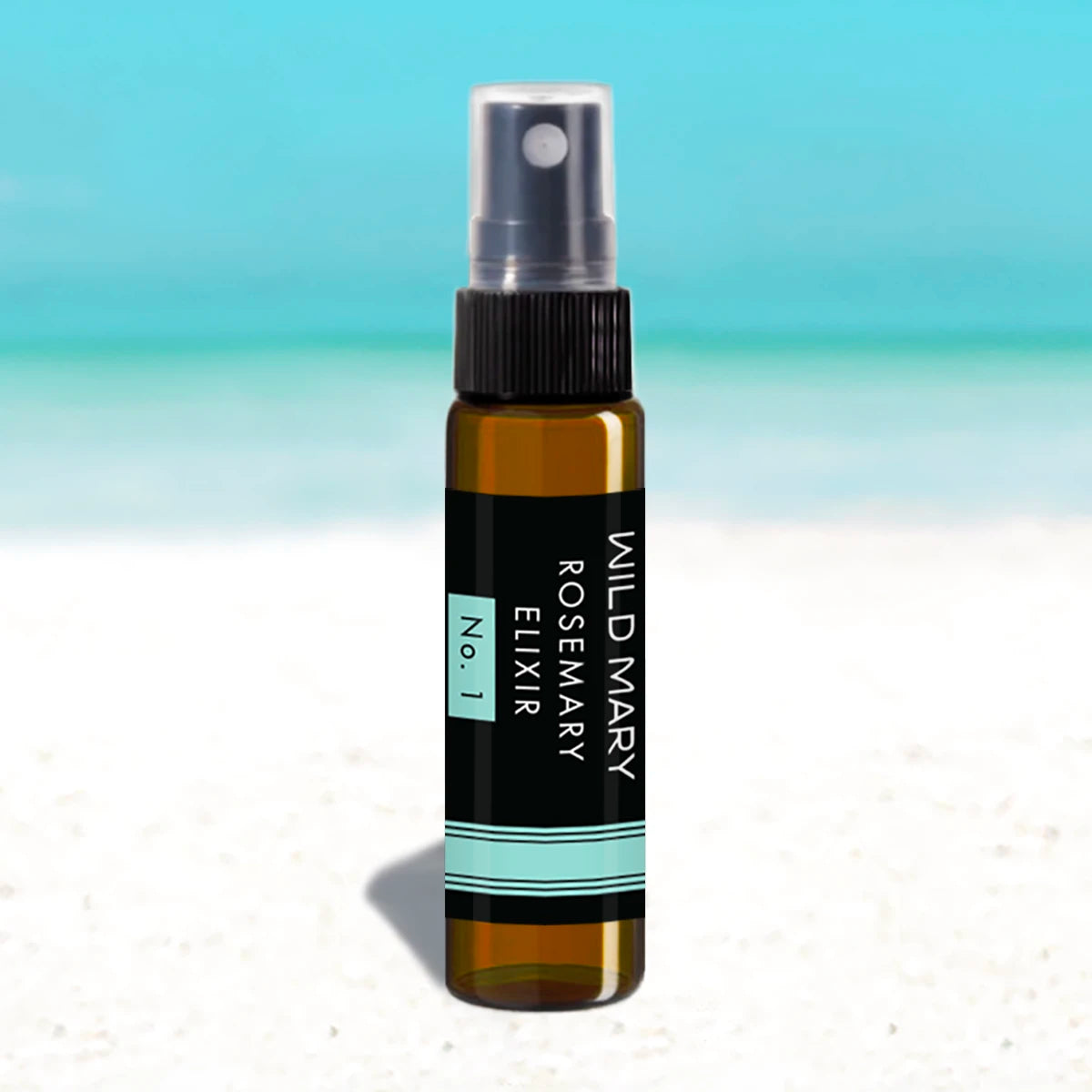 Wild Mary Mini Rosemary Elixir No. 1 Rosemary Milky Essence Toner in an amber glass spray bottle on Holbox Island beach