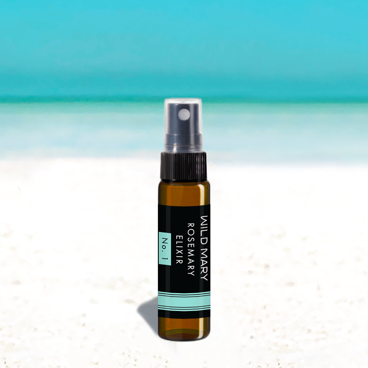 Wild Mary Mini Rosemary Elixir No. 1 Rosemary Milky Essence Toner in a black glass spray bottle on Holbox Island beach