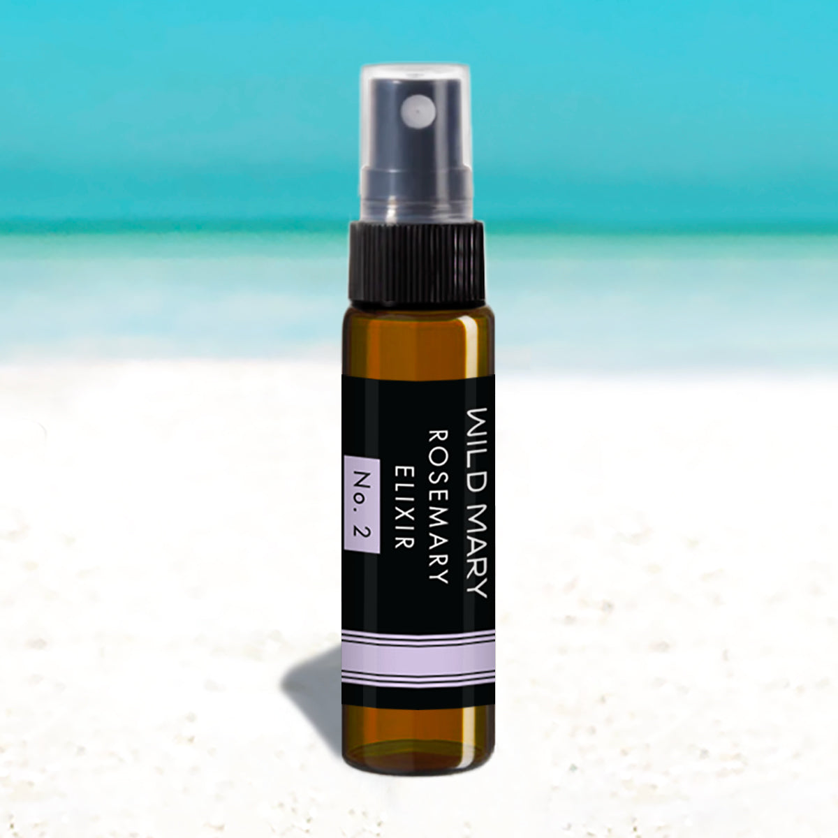 Wild Mary Mini Rosemary Elixir No. 2 Lavender Milky Essence Toner in a black glass spray bottle on Holbox Island beach