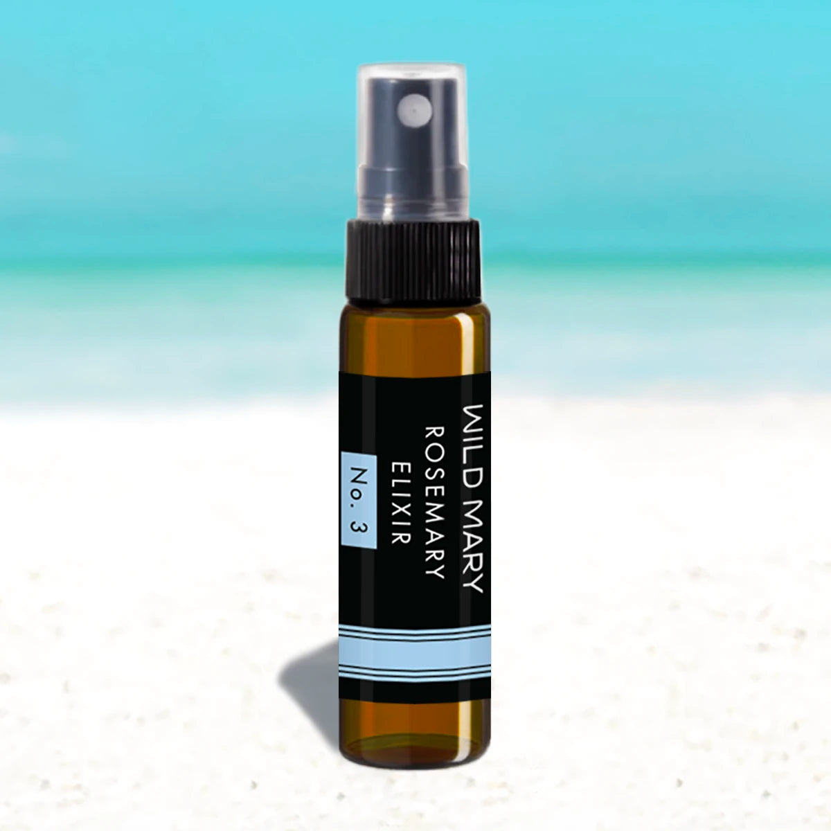 Wild Mary Mini Rosemary Elixir No. 3 Rosemary Mint Milky Essence Toner in an amber glass spray bottle on Holbox Island beach