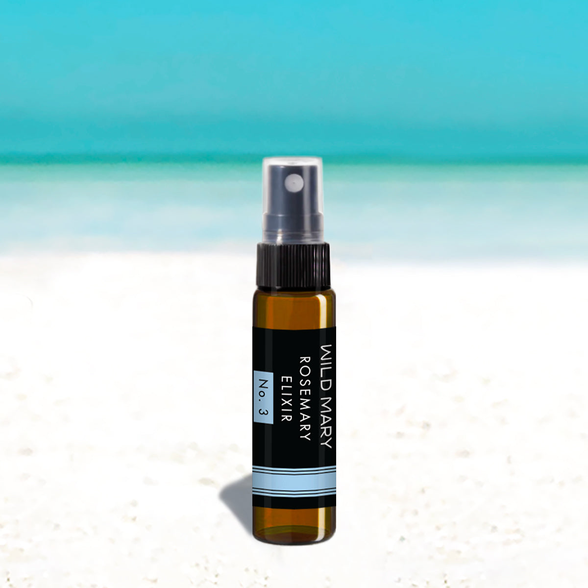 Wild Mary Mini Rosemary Elixir No. 3 Rosemary Mint Milky Essence Toner in a black glass spray bottle on Holbox Island beach