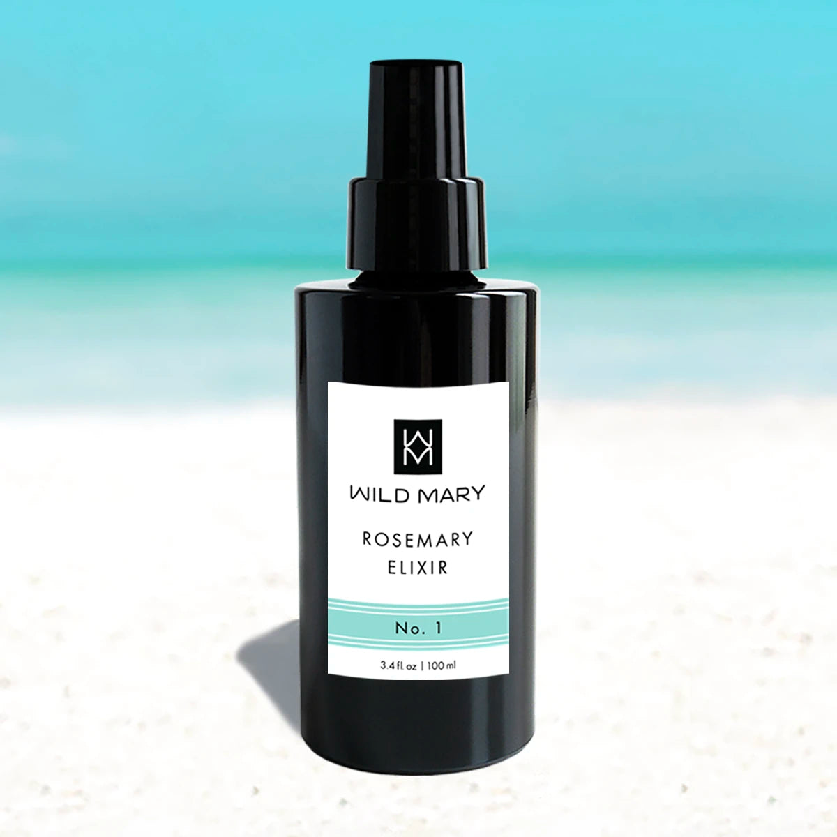 Wild Mary Rosemary Elixir No. 1 Rosemary Milky Essence Toner in a black glass spray bottle on Holbox Island beach
