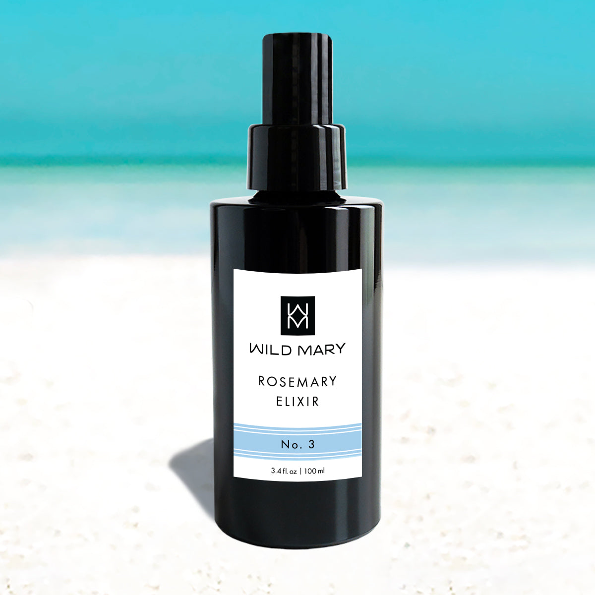 Wild Mary Rosemary Elixir No. 1 Rosemary Mint Milky Essence Toner in a black glass spray bottle on Holbox Island beach