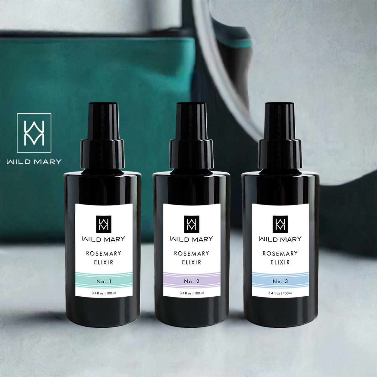 Wild Mary Rosemary Elixir Trio featuring No. 1 Rosemary, No. 2 Lavender, and No. 3 Rosemary Mint Restorative Face Oils on a vanity.